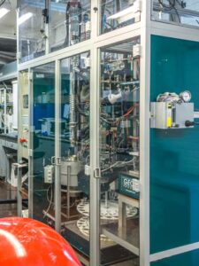 “Advanced HTI laboratory equipment enclosed in glass panels, showcasing pilot-scale testing and innovative process technology.